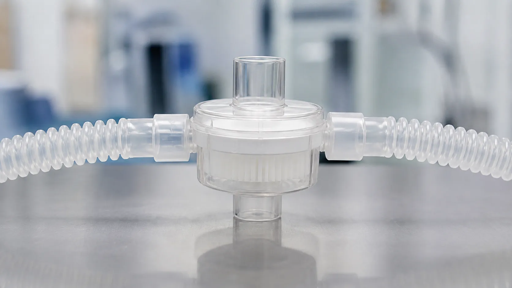 Pleated hydrophobic breathing system filter with an integrated HME fitted at the patient end of an a
