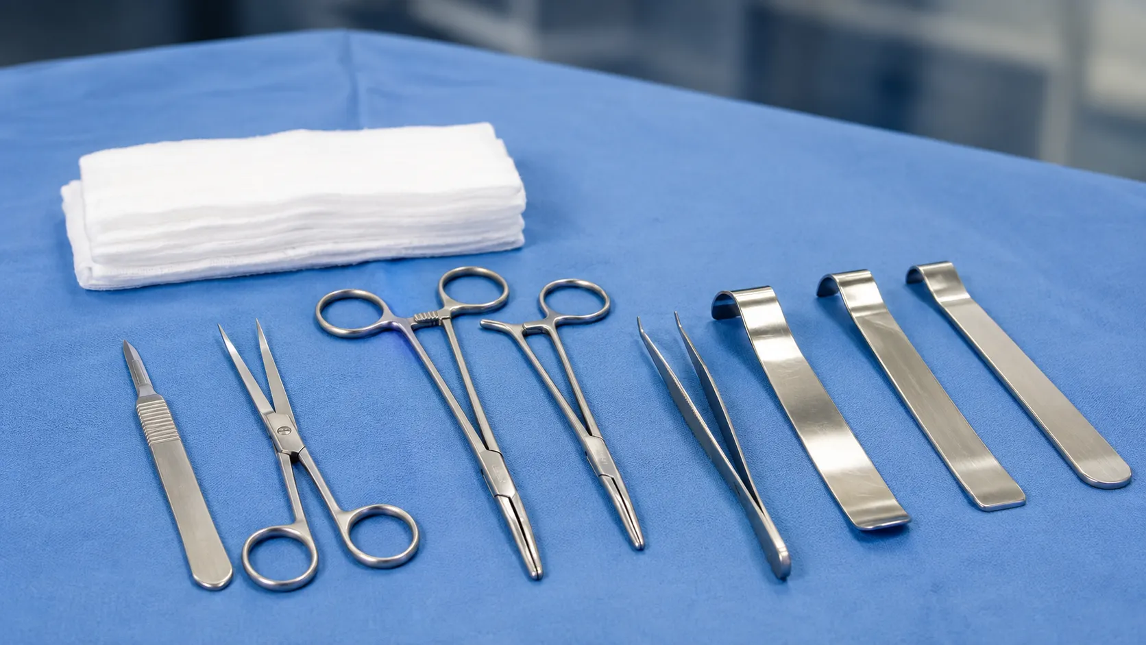 Surgeon using retractors and long scissors to release the fascia of a lower leg compartment
