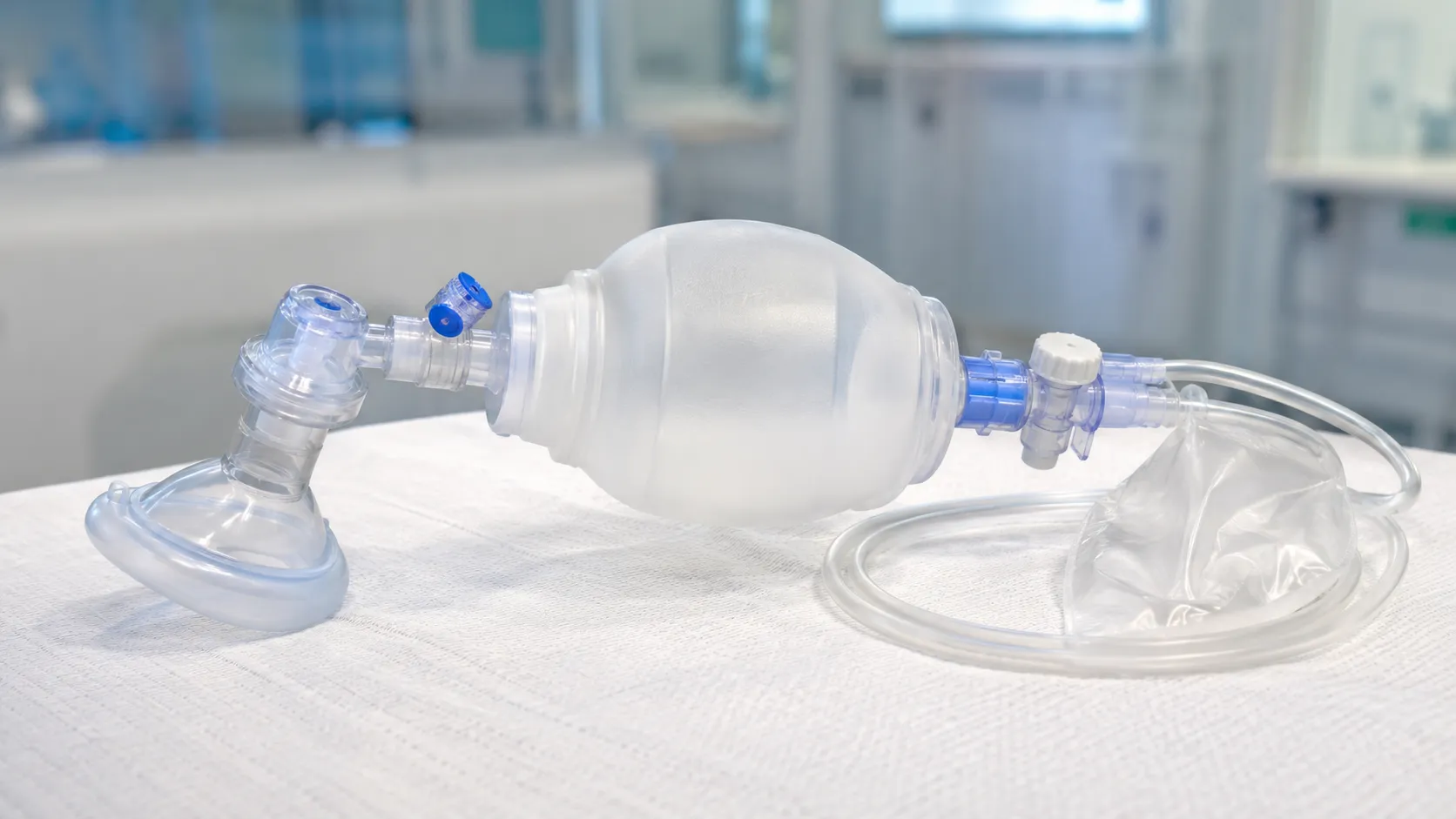 Neonatal flow-inflating anaesthesia bag with manometer and mask connected to an air-oxygen blender i